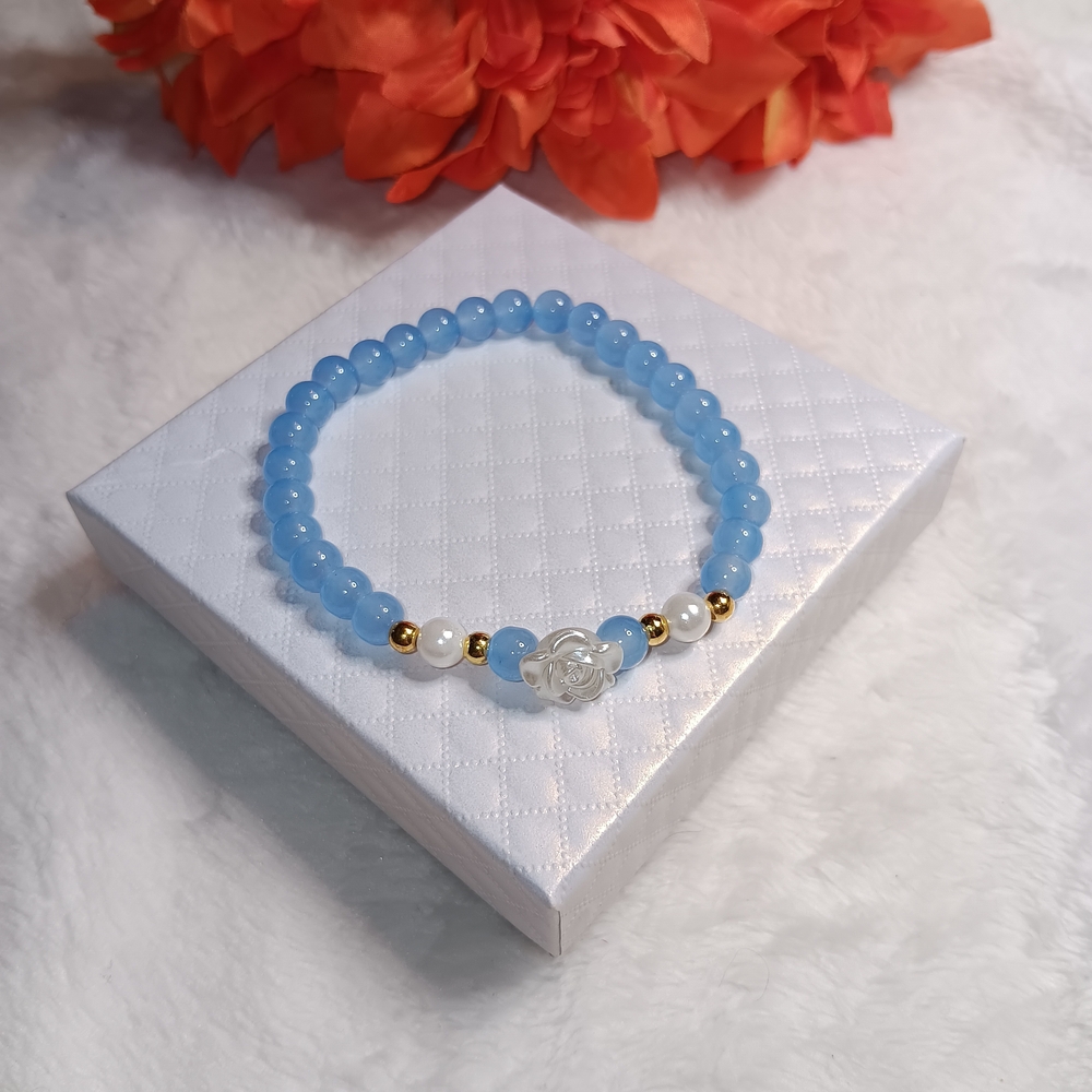 Elegant Blue Beaded Bracelet with Gold Accents And Flower Charm